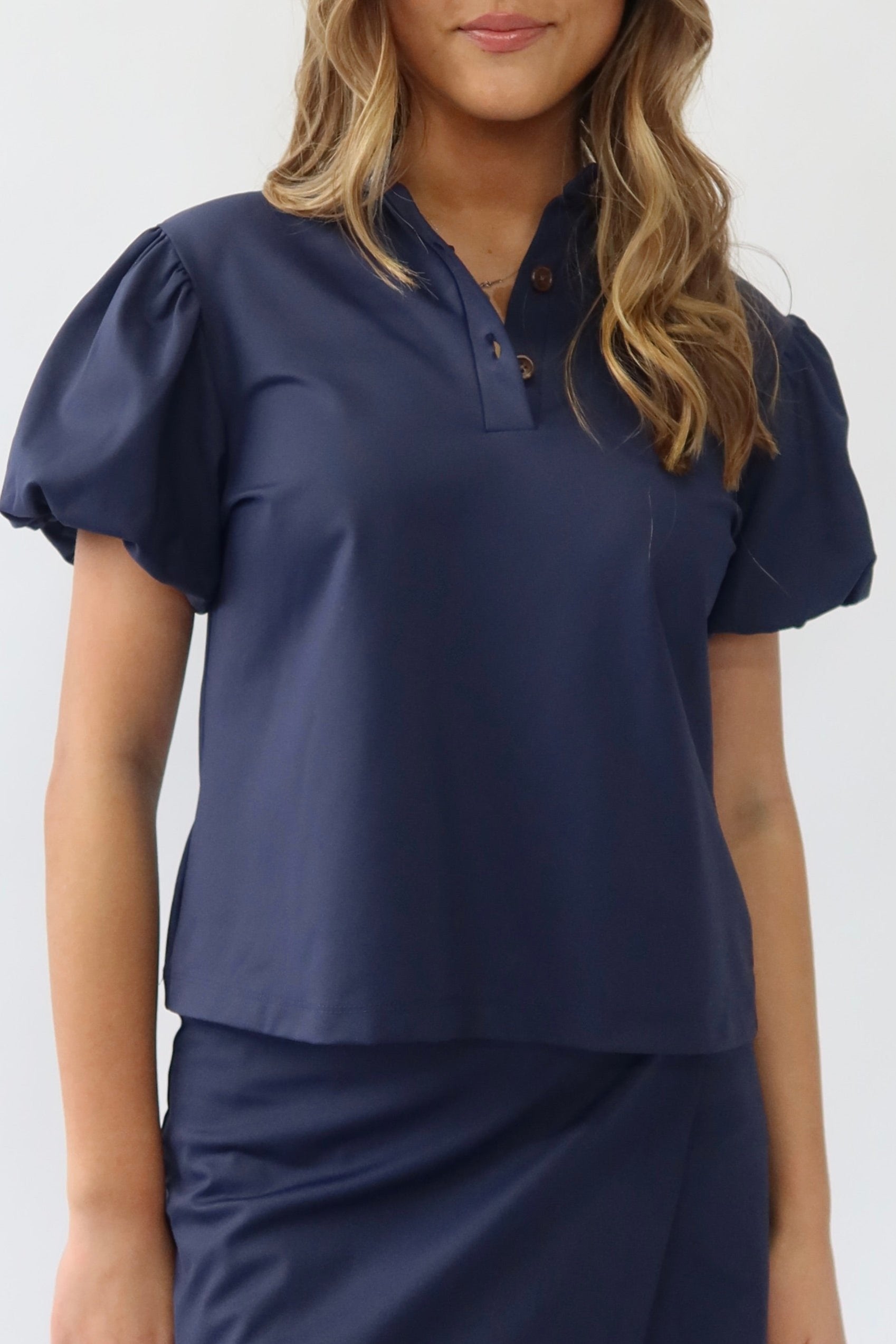 the garde women's golf puff sleeve polo in navy